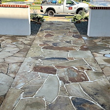 Professional-Softwashing-of-a-Stucco-Home-and-Sandstone-Walkway-Patio 0